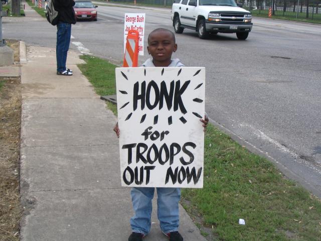 "Honk for Troops Out Now"